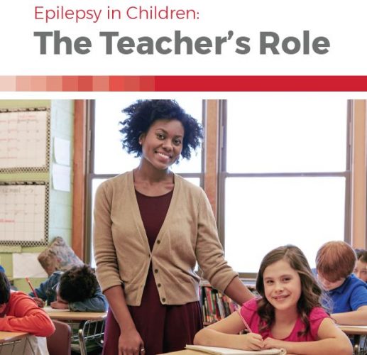 Booklet cover — image of a teacher smiling with her arm around a student sitting at her desk, surrounding by other students working, and title, Epilepsy in Children: The Teacher's Role.