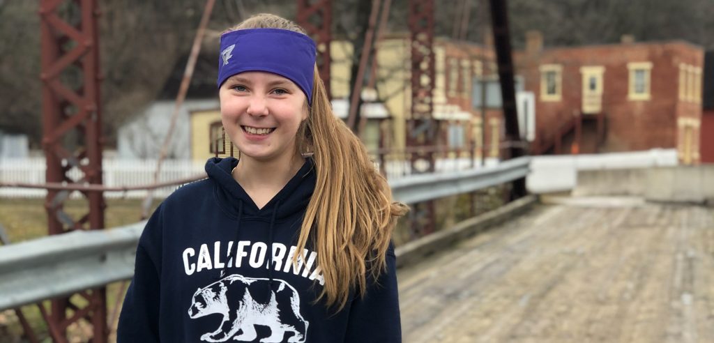 Teen girl smiling on bridge