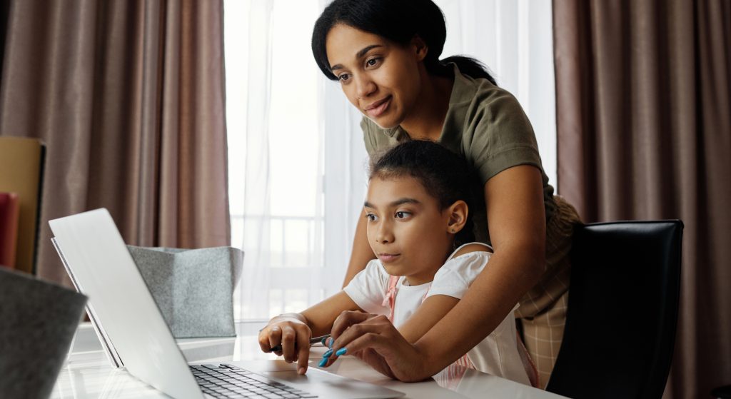 Mom and daughter using a laptop