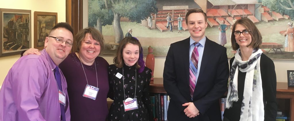 Poshek family with EFMN advocacy director Heather Besonen at political office