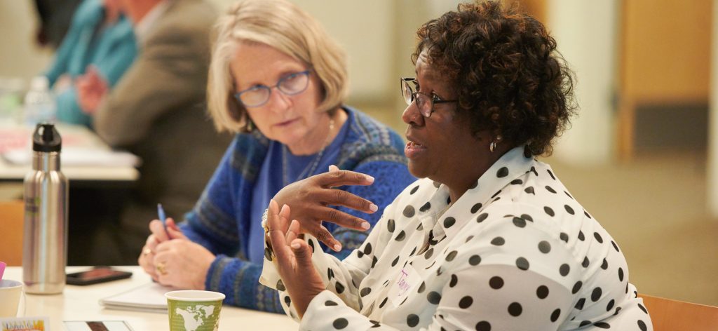 One woman talking, another listening