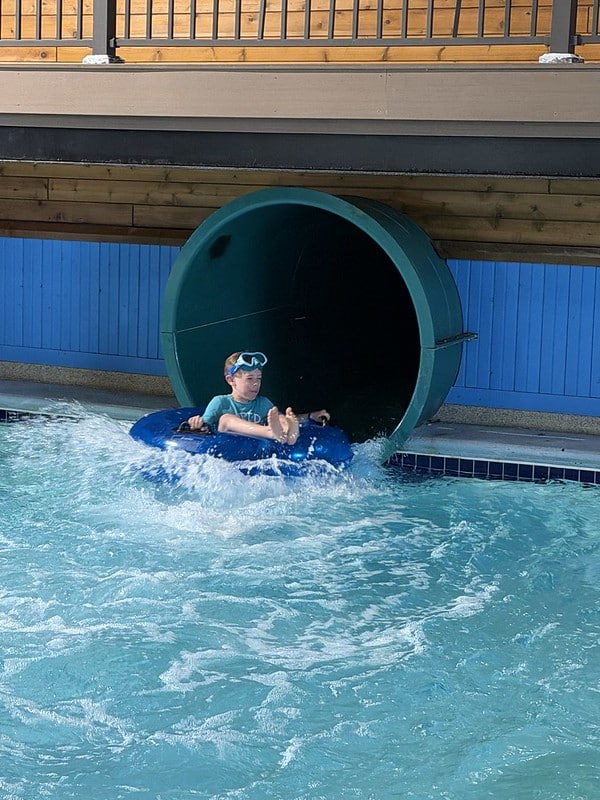 Attendee in an inner tube going down the waterslide